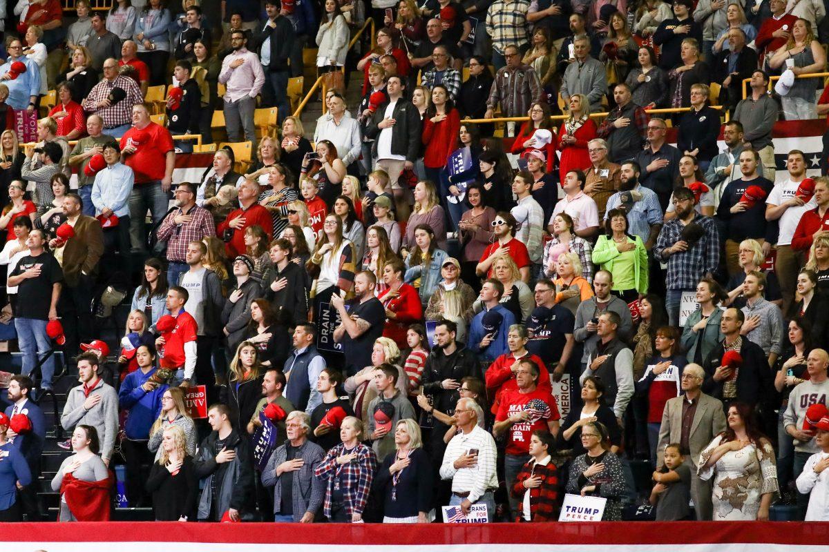Attendees sing the national anthem at a Make America Great Again rally in Chattanooga, Tenn., on Nov. 4, 2018. (Charlotte Cuthbertson/The Epoch Times)