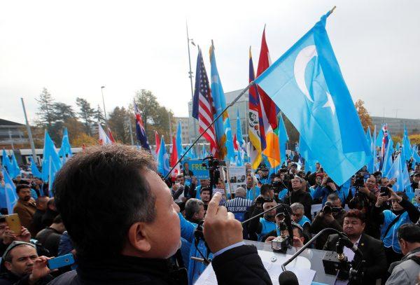 Dolkun Isa, president of the World Uyghur Congress, gestures as he speaks during a demonstration against China during its Universal Periodic Review by the Human Rights Council in front of the United Nations office in Geneva, on Nov. 6, 2018. (Denis Balibouse/Reuters)