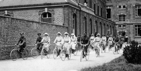 A group of nursing sisters and officers cycling together at No. 6 Canadian General Hospital in Le Tréport, France, on June 2, 1917. (Library and Archives Canada)