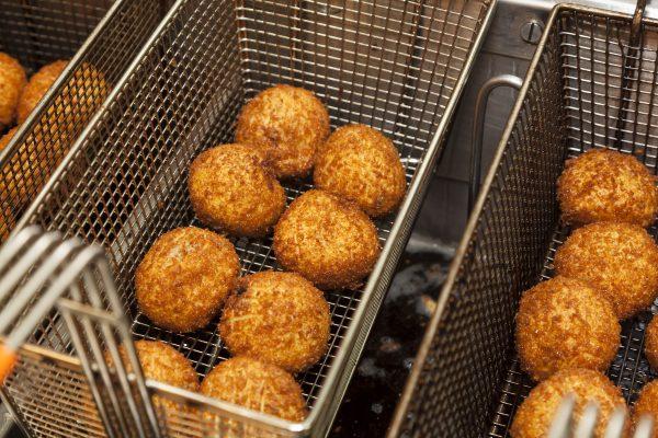 The bakery's signature potato balls are deep-fried to crisp, golden brown perfection. (Courtesy of Porto's Bakery & Cafe)