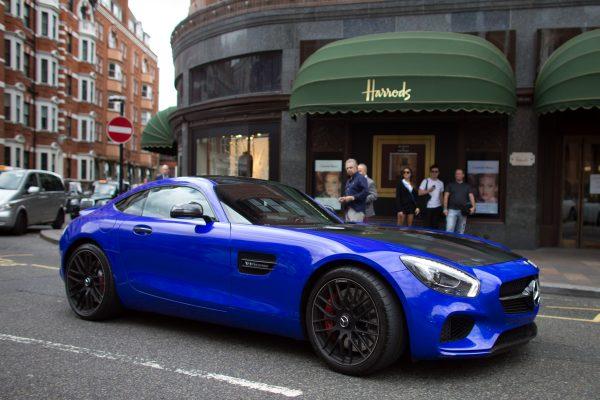 A Qatari-registered Mercedes AMG GTS is driven past Harrods in London on July 23, 2015. (Carl Court/Getty Images)