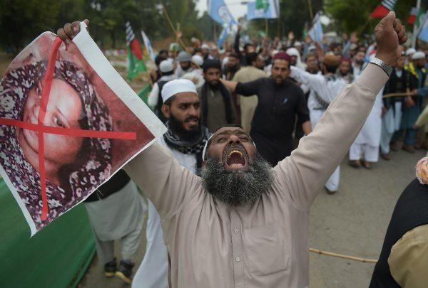  A Pakistani supporter of the Ahle Sunnat Wal Jamaat, a hard-line religious party, holds an image of Asia Bibi during a protest rally following the Supreme Court's decision to acquit Bibi of blasphemy, in Islamabad, Pakistan, on Nov. 2, 2018. (Aamir Qureshi/AFP/Getty Images)