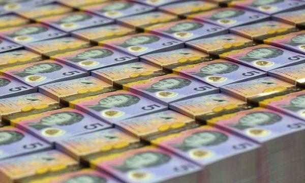In this undated handout photo from the Reserve Bank of Australia (RBA) released on April 12, 2016 stacks of new style five Australian dollar note are seen, which will replace its more bland pink, purple and orange predecessor from September 1, 2016.(STR/AFP/Getty Images)