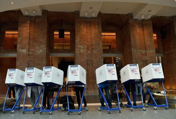 Voters cast their ballot in the midterm election at the Brooklyn Museum polling station in New York City on November 6, 2018. (Photo by Angela Weiss / AFP) (Photo credit should read ANGELA WEISS/AFP/Getty Images)