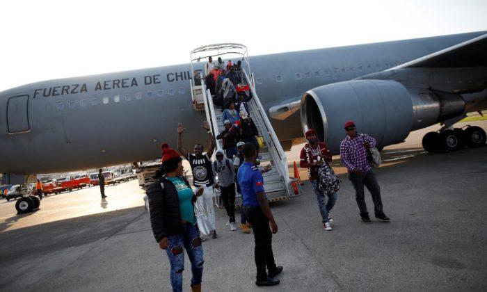 President of Chile Flies 176 Haitian Immigrants Home