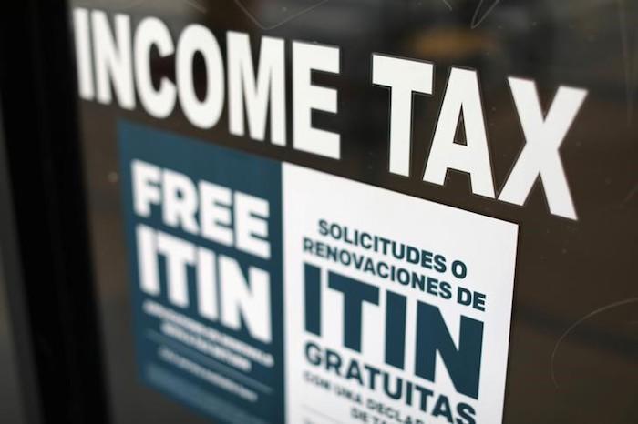 A tax sign is pictured on an H&R Block tax office in Los Angeles, Calif., on April 26, 2017. (Mike Blake/Reuters)