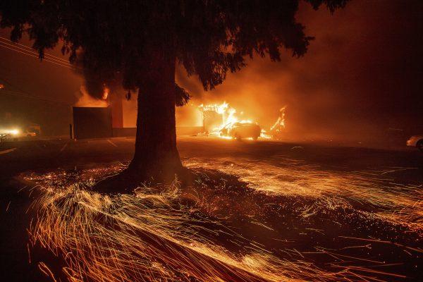 Flames consume a Kentucky Fried Chicken as the Camp Fire tears through Paradise, Calif., on Thursday, Nov. 8, 2018. (AP Photo/Noah Berger)