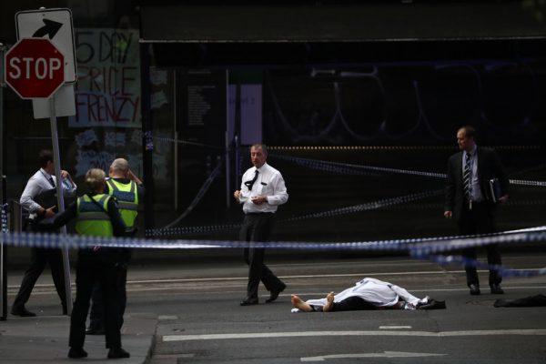 Police examine a body in Bourke St. in Melbourne, Australia, on Nov. 9, 2018. (Robert Cianflone/Getty Images)