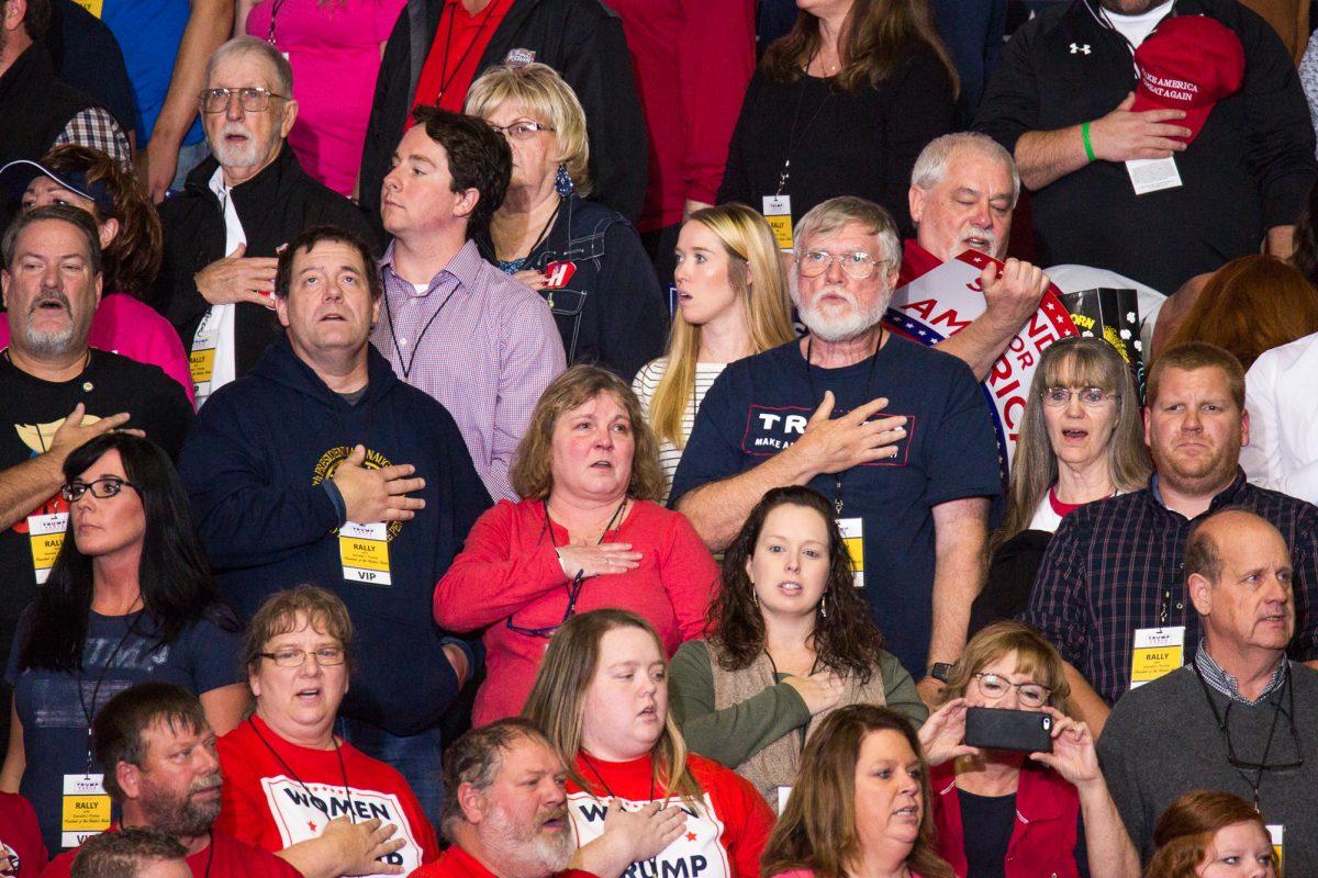 Attendees sing the national anthem at a Make America Great Again rally in Cape Girardeau, Mo., on Nov. 5, 2018. (Hu Chen/The Epoch Times)