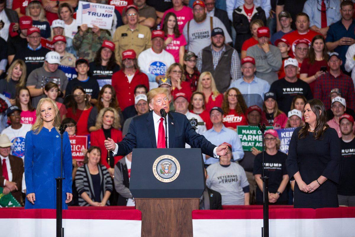 (L-R) Counselor to the President Kellyanne Conway, President Donald Trump, and White House Press Secretary Sarah Sanders at a Make America Great Again rally in Cape Girardeau, Mo., on Nov. 5, 2018. (Hu Chen/The Epoch Times)