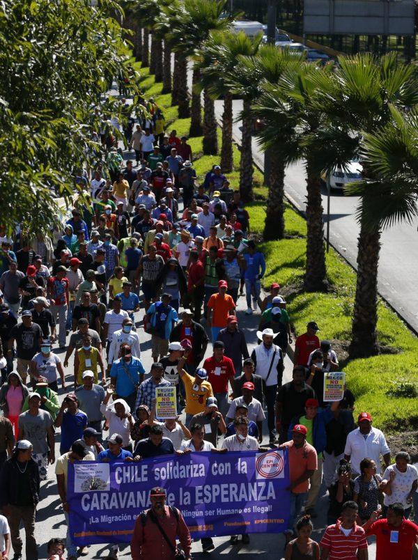 The main migrant caravan marches in a demonstration in Mexico City on Nov. 8, 2018. They departed the city the next day. (AP Photo/Rebecca Blackwell)