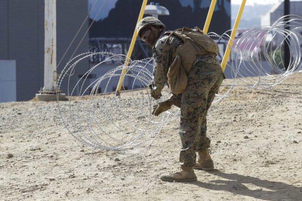 Marine Corps engineers from Camp Pendleton put up razor wire just east of the San Ysidro Port of Entry where trains pass from the United States into Mexico, and Mexico into the United States, to support Border Patrol on Nov. 6, 2018. (John Gibbins/The San Diego Union-Tribune via AP)