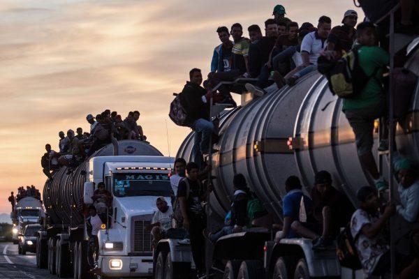 A truck carrying mostly Honduran migrants taking part in a caravan heading to the US drives from Santiago Niltepec to Juchitan, near the town of La Blanca in Oaxaca State, Mexico, on Oct. 30, 2018. (Guillermo Arias/AFP/Getty Images)