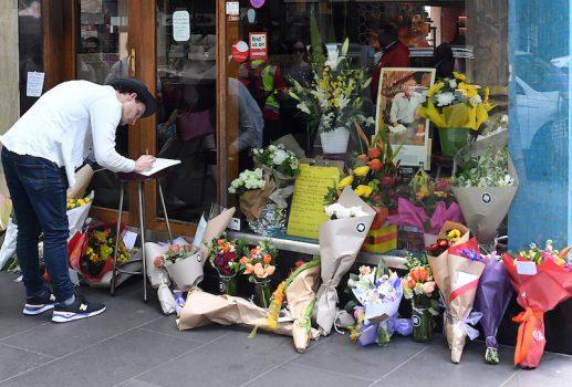 Floral tributes can be seen outside Melbourne's Pellegrini's Cafe for Sisto Malaspina, the day after he was stabbed to death in an attack police have called an act of terrorism, in central Melbourne, Australia, on Nov. 10, 2018. (AAP/James Ross/via Reuters)