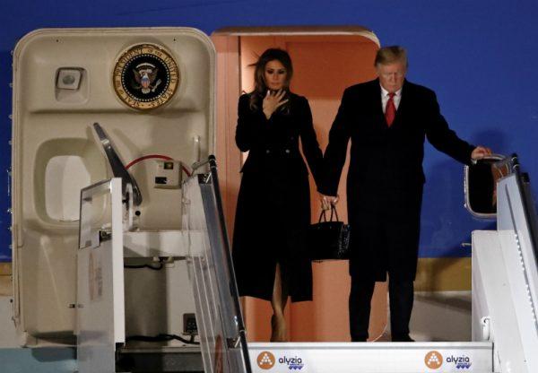 President Donald Trump and first lady Melania Trump exit Air Force One as they arrive at Orly Airport near Paris to attend commemoration ceremonies for Armistice Day, 100 years after the end of the First World War, France, on Nov. 9, 2018. (Christian Hartmann/Reuters)