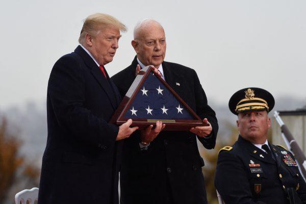 US President Donald Trump (L) and US Major General and ABMC (American Battle Monuments Commission) Secretary William M. Matz take part in a US ceremony at the American Cemetery of Suresnes, outside Paris, on Nov. 11, 2018 as part of Veterans Day and commemorations marking the 100th anniversary of the Nov. 11, 1918, armistice, ending World War I. (Saul Loeb/AFP/Getty Images)