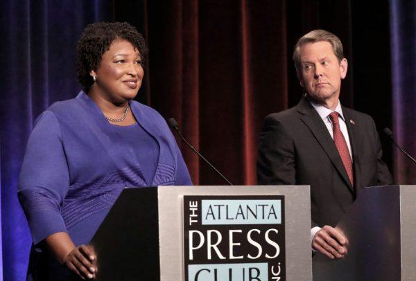 Georgia gubernatorial candidates (L-R) Democrat Stacey Abrams and Republican Brian Kemp debate in an event that also included Libertarian Ted Metz at Georgia Public Broadcasting on Oct. 23, 2018, in Atlanta. (John Bazemore-Pool/Getty Images)