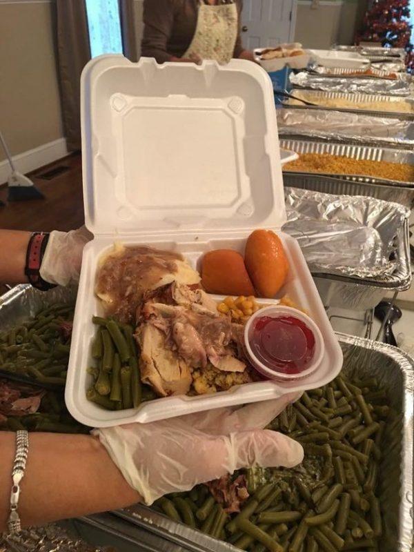 A turkey supper is being assembled for someone in need of a warm meal. (Courtesy of Operation Turkey)