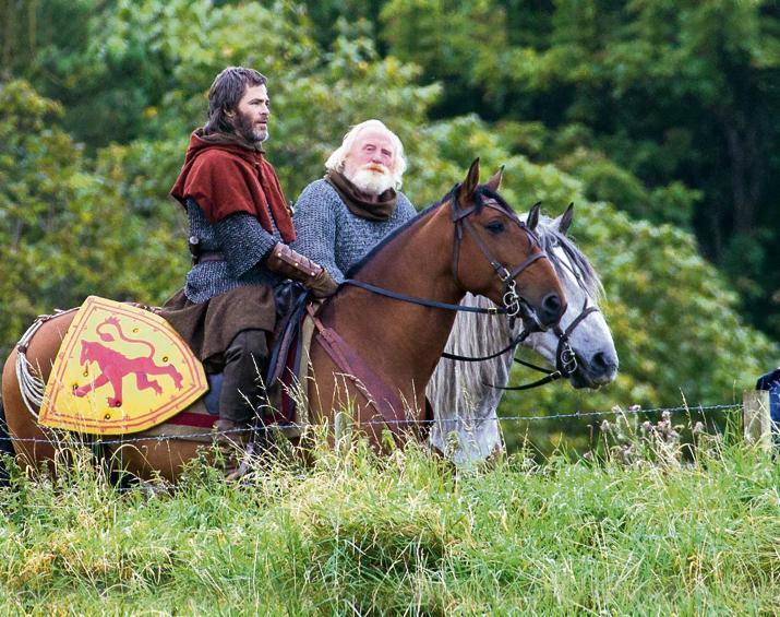 Chris Pine (L) and James Cosmo play son and father in “Outlaw King.” (David Eustace/Netflix)