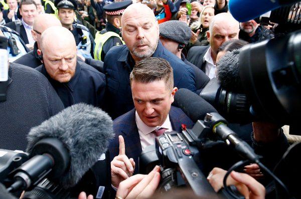 Activist Stephen Yaxley-Lennon, who goes by the name Tommy Robinson, leaves the Old Bailey after his contempt of court charge was referred to the Attorney General, in London on Oct. 23, 2018. (Reuters/Henry Nicholls/File Photo)