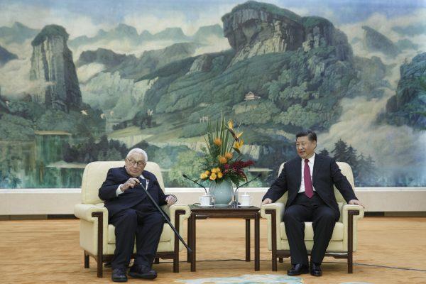 Chinese President Xi Jinping meets former U.S. Secretary of State Henry Kissinger at the Great Hall of the People, in Beijing, China, on Nov. 8, 2018. (Thomas Peter/Pool/Getty Images)