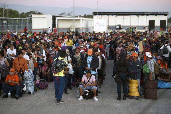 Central American migrants heading for the United States wait for buses at La Concha phytosanitary station in the State of Sinaloa, Mexico, on Nov. 13, 2018. (ALFREDO ESTRELLA/AFP/Getty Images)