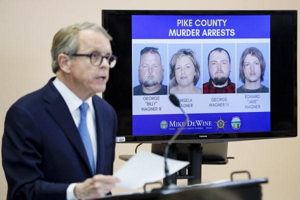 Ohio Attorney General Mike DeWine speaks alongside a display of those arrested during a news conference in Waverly, Ohio, on Nov. 13, 2018. (John Minchillo/AP)