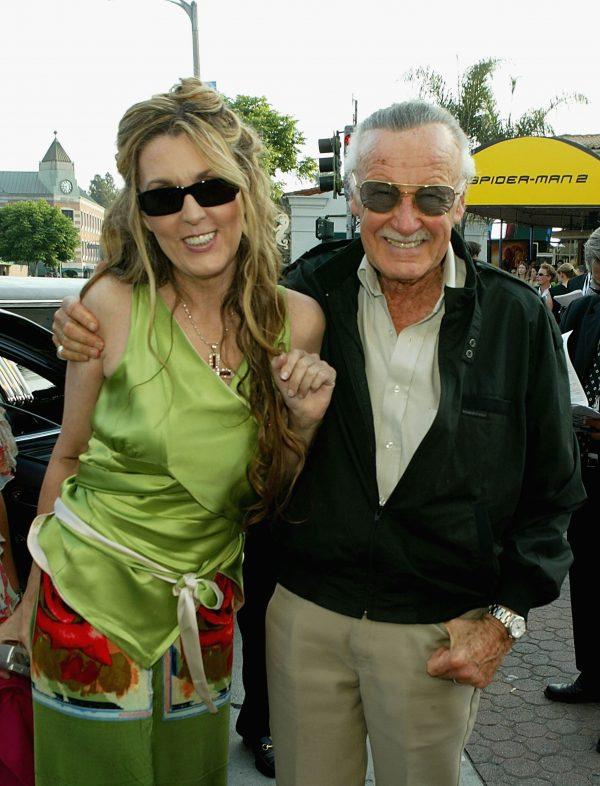 File photo showing Stan Lee and his daughter J.C. Lee as they attend the premiere of the film "Spider-Man 2" at the Mann Village Theater, in Westwood, California, on June 22, 2004. (Kevin Winter/Getty Images)