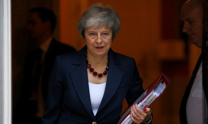 May Secures Draft Divorce Deal With EU, Faces Hostile UK Lawmakers