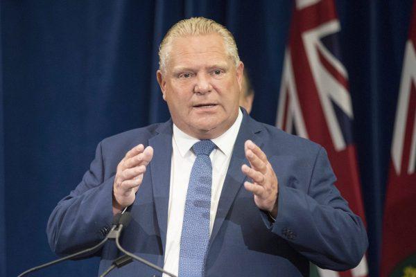 Ontario Premier Doug Ford stands at the podium during a press announcement at the Queens Park Legislature in Toronto on Aug. 9, 2018. (THE CANADIAN PRESS/Chris Young)