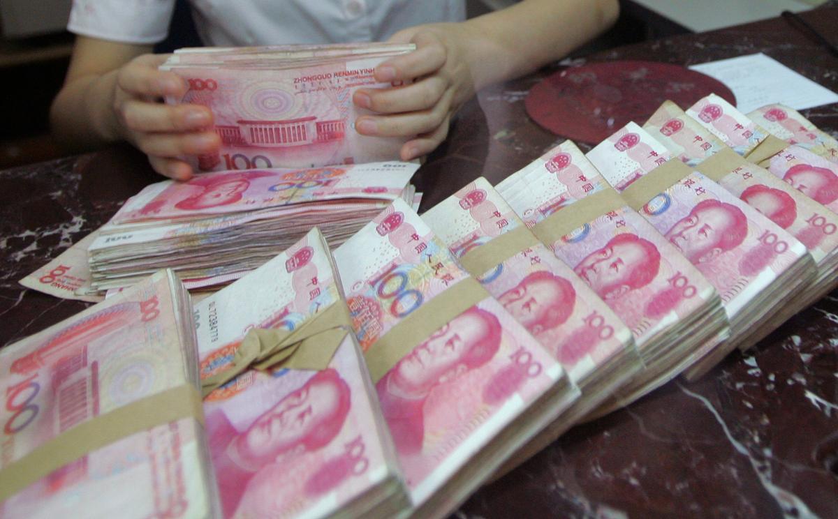 China's Yuan Slumps to 11-Year Low as US-China Trade War Escalates