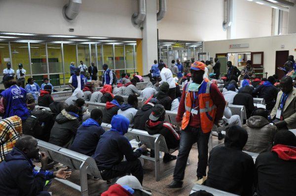 Returnees from Libya wait at the Yaounde Nsimalen International Airport lounge on April 19, 2018. (IOM/Serena Pescatore)