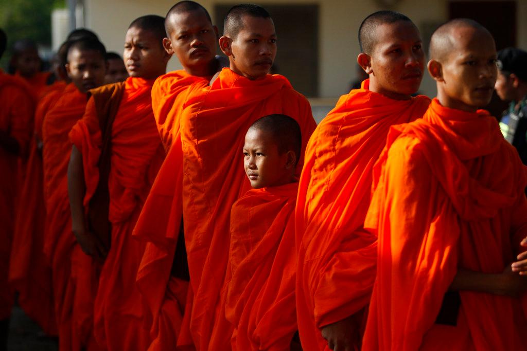Cambodian Buddhist monks wait in queue to enter into the courtroom before the hearings against two former Khmer Rouge senior leaders, at the U.N.-backed war crimes tribunal on the outskirts of Phnom Penh, Cambodia, on Nov. 16, 2018. (AP Photo/Heng Sinith)