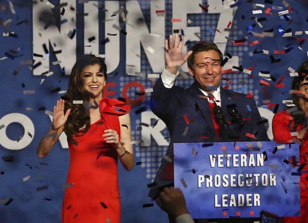 Ron DeSantis and his wife Casey celebrate after winning the Florida Governor's race during DeSantis' party at the Rosen Centre in Orlando on Orlando, Fla., on Nov. 6, 2018. (Stephen M. Dowell/Orlando Sentinel via AP)