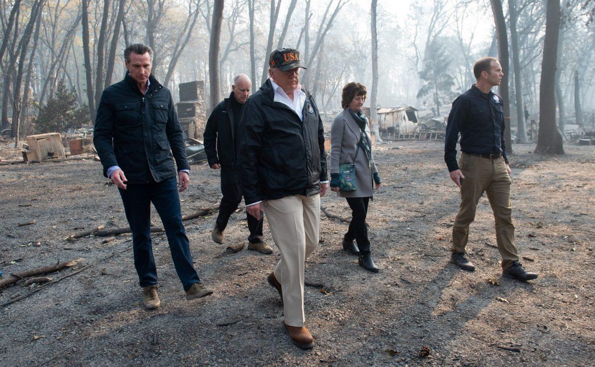 President Donald Trump (C) walks with Paradise Mayor Jody Jones (2nd R), Governor of California Jerry Brown (2nd L), Administrator of the Federal Emergency Management Agency, Brock Long (R), and Lieutenant Governor of California, Gavin Newsom, as they view damage from wildfires in Paradise, Calif., on Nov. 17, 2018. (Saul Loeb/AFP/Getty Images)