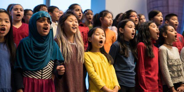 Students with an ETM music program sing at a performance at the World Trade Center in New York in 2017. (Education Through Music)