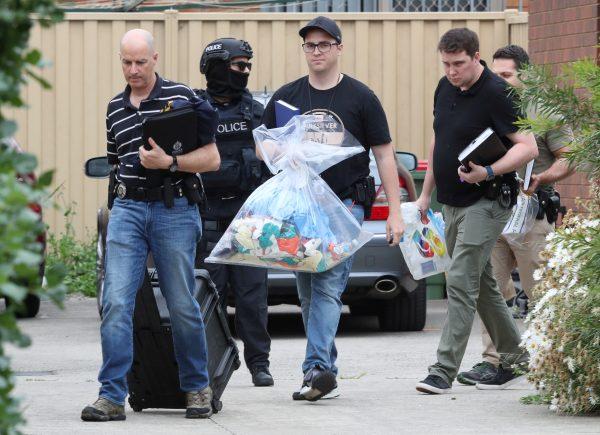 Police are seen outside one of the houses involved in counter-terrorism raids across the north-western suburbs in Melbourne, Australia, Nov. 20, 2018. (AAP/David Crosling/via REUTERS)