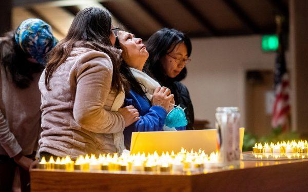 Lidia Steineman, who lost her home, prays during a vigil for the lives and community lost to the Camp Fire at the First Christian Church of Chico in Chico, California, November 18, 2018. (Noah Berger/Pool via Reuters)
