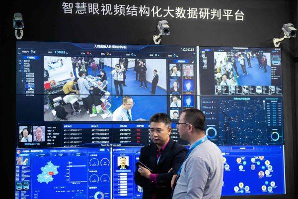 Visitors are filmed by artificial intelligence security cameras using facial recognition technology at an international security expo at the China International Exhibition Center in Beijing on Oct. 24, 2018. (Nicolas Asfouri/AFP/Getty Images)