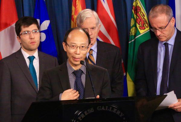 He Lizhi, a Falun Dafa adherent who was persecuted in China, speaks at a press conference ahead of a House of Commons session to debate organ trafficking bill S-240 on Parliament Hill, Ottawa, on Nov. 20, 2018. (Jonathan Ren/The Epoch Times)