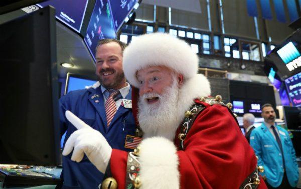 Santa Claus pays a visit on the floor at the New York Stock Exchange (NYSE) in New York, on Nov. 21, 2018. (Brendan Mcdermid/File Photo/Reuters)