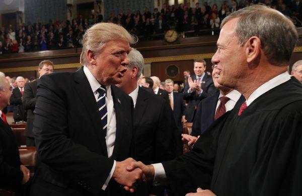President Donald Trump (L) shakes hands with Chief Justice John Roberts (R) in the House chamber of the U.S. Capitol on Feb. 28, 2017. (Jim Lo Scalzo - Pool/Getty Images)