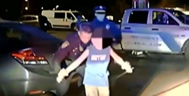 A video shot in Ohio shows a police officer disarming a 12-year-old boy who was holding a large knife to his own throat, on Nov. 19, 2018. (Grove City Police)