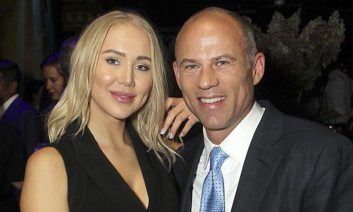 Attorney Michael Avenatti poses with Mareli Miniutti for a photo at a party in New York in September 2018. (Marion Curtis/StarPix via AP)