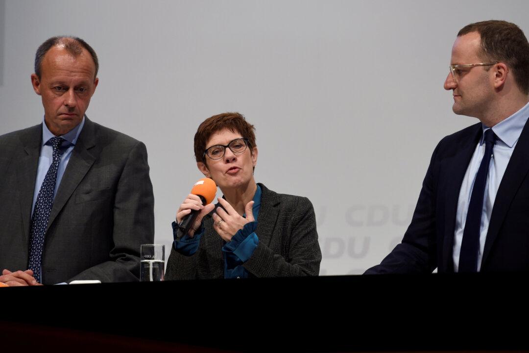 Merkel’s Would-Be Successor Questions Germany’s Constitutional Asylum Pledge