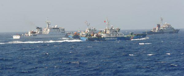 A Chinese coast guard ship (L) blocked by three Vietnamese coast guard vessels near China's oil drilling rig in disputed waters in the South China Sea on May 15, 2014. (Hoang Dinh/ Nam/AFP/Getty Images)