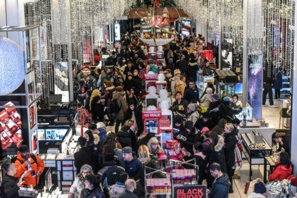 A large crowd of people shop during a Black Friday sales event at Macy's flagship store on 34th St. in New York City, on Nov. 22, 2018. (Stephanie Keith/Reuters)