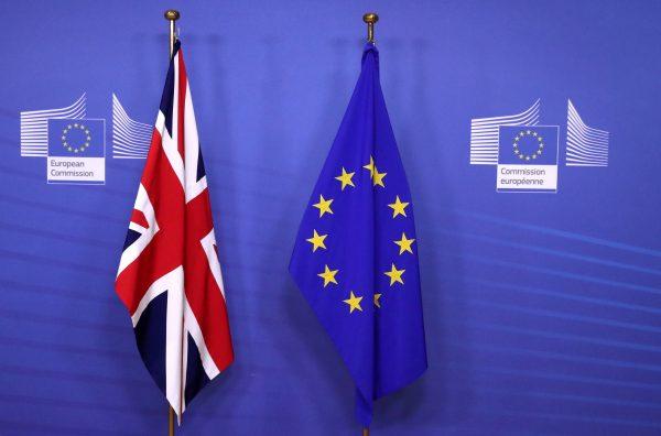 British and EU flags are seen before Britain's Prime Minister Theresa May meets with Commission President Jean-Claude Juncker to discuss draft agreements on Brexit, at the EC headquarters in Brussels, Belgium, on Nov. 21, 2018. (Yves Herman/Reuters File Photo)