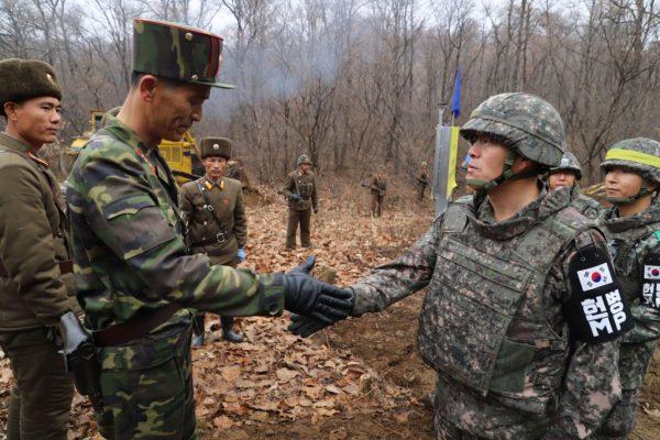 South Korean soldiers gather at Arrowhead Ridge, a site of battles in the 1950-53 Korean War, as a tactical road is built across the military demarcation line inside the Demilitarized Zone (DMZ) in Cheorwon, Gangwon Province, South Korea on Nov. 22, 2018. (Kim Min-Hee/AFP/Getty Images)