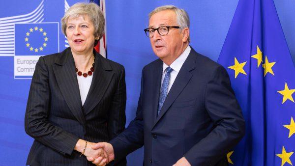 Prime Minister of the United Kingdom Theresa May (L) is welcomed by the President of the European Commission Jean-Claude Juncker (R) in the Berlaymont, the EU Commission headquarters in Brussels, Belgium, on Nov. 21, 2018. (Thierry Monasse/Getty Images)
